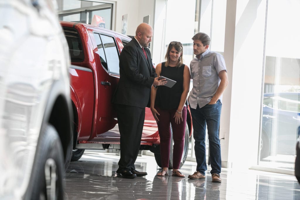 car shoppers at dealership